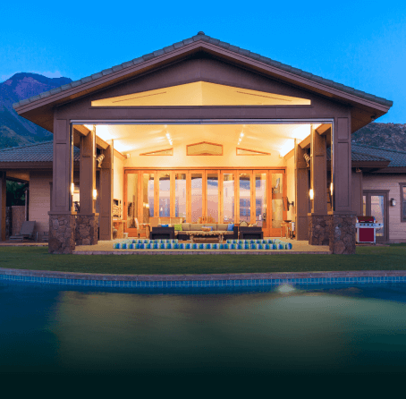 Contemporary home with a swimming pool at dusk